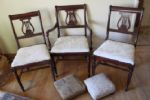BEAUTIFUL AND STURDY ANTIQUE WOOD CHAIRS, MUSICAL EMBLEM BACK AND FOOT STOOLS