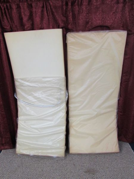 TWO SECTIONS OF FOAM FORMALLY USED FOR CAMP COT PADS