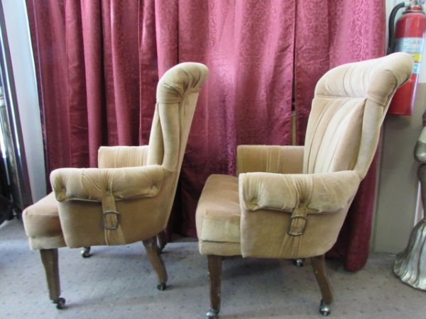 TWO UPHOLSTERED ROLLING DINING CHAIRS