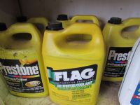 FIVE GALLONS OF PRESTONE ANTIFREEZE AND A GALLON OF AMS-OIL ANTIFREEZE.