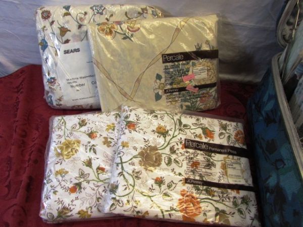 HUGE VARIETY OF NEVER USED SHEETS , 2 MATTRESS PADS & A CASE TO CARRY THEM HOME IN 