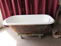 CLAW FOOT BATHTUB WITH VINTAGE FAUCETS