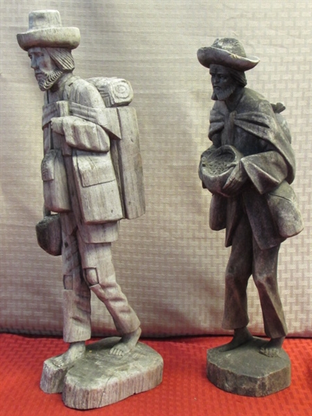 TWO WONDERFULLY RUSTIC HAND CARVED WOOD STATUES