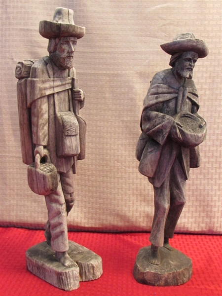 TWO WONDERFULLY RUSTIC HAND CARVED WOOD STATUES