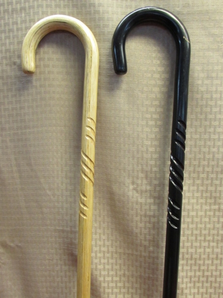 A PAIR OF NICE, SOLID WOOD CARVED WALKING CANES 