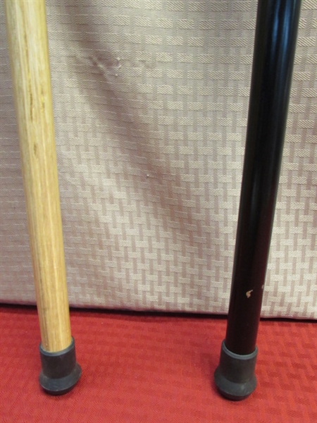 A PAIR OF NICE, SOLID WOOD CARVED WALKING CANES 