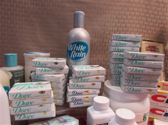 DOZENS OF NEVER USED BARS OF SOAP, 5 NEW TUBES OF TOOTHPASTE, CLEANING PRODUCTS & SO MUCH MORE