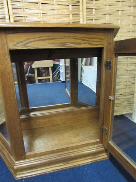 LIGHTED OAK CURIO CABINET WITH MIRRORED BACK