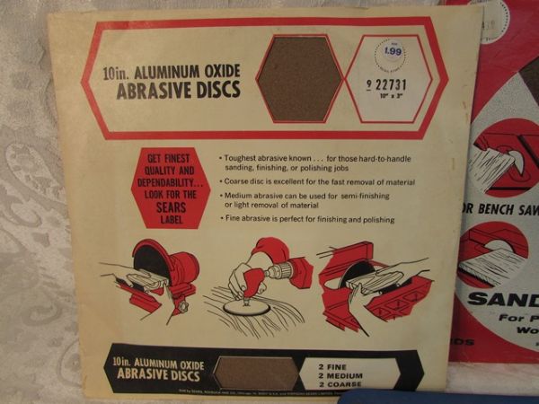 FIVE 10 SAW BLADES, SANDING WHEEL AND ALUMINUM OXIDE DISCS