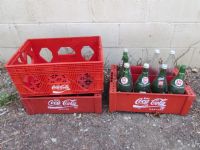 THREE COCA COLA CRATES WITH 7-UP BOTTLES