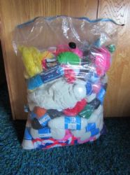  SANTAS BAG DOES NOT HOLD MORE THAN THIS MASSIVE STORAGE BAG FILLED WITH YARN & STARTED PROJECTS