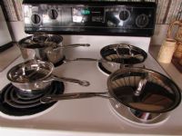 EIGHT PIECE SET OF  CUISINART STAINLESS STEEL PANS