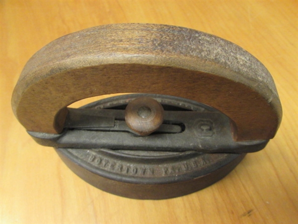 TWO ANTIQUE FLAT IRONS, ONE WITH WOODEN HANDLE