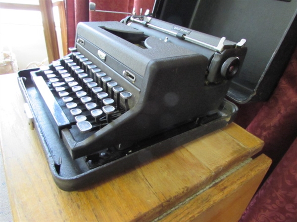 VINTAGE ROYAL TYPEWRITER WITH ROLLING TABLE