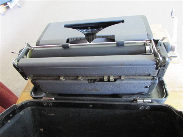 VINTAGE ROYAL TYPEWRITER WITH ROLLING TABLE