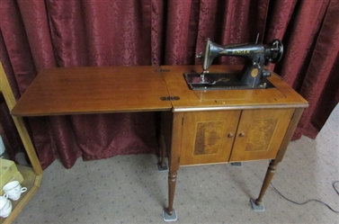 VINTAGE KNEE OPERATED SINGER SEWING MACHINE IN CABINET