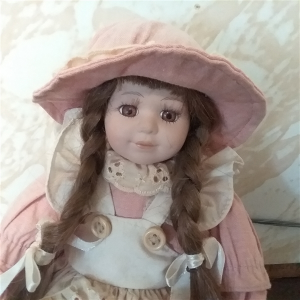 11 POSEABLE PORCELAIN DOLL