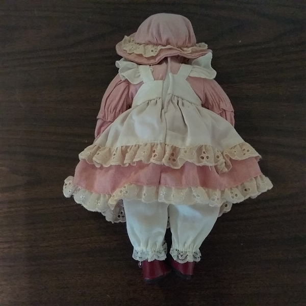 11 POSEABLE PORCELAIN DOLL