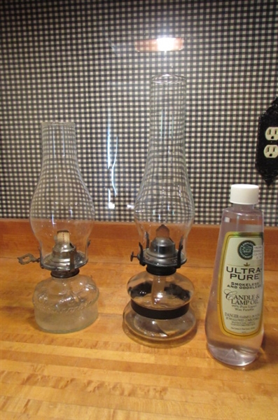 2 VINTAGE OIL LAMPS & BOTTLE OF LAMP OIL