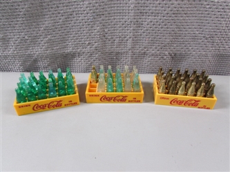 Three Crates of Miniature Coca-Cola Bottles-Gold and Plastic
