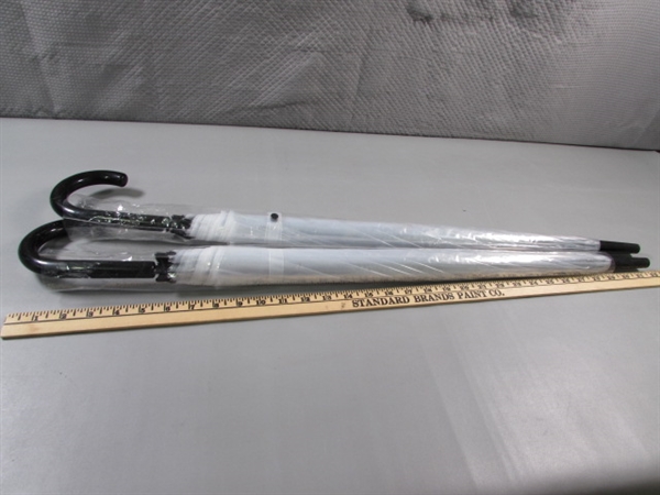 NEW - PAIR OF CLEAR UMBRELLAS