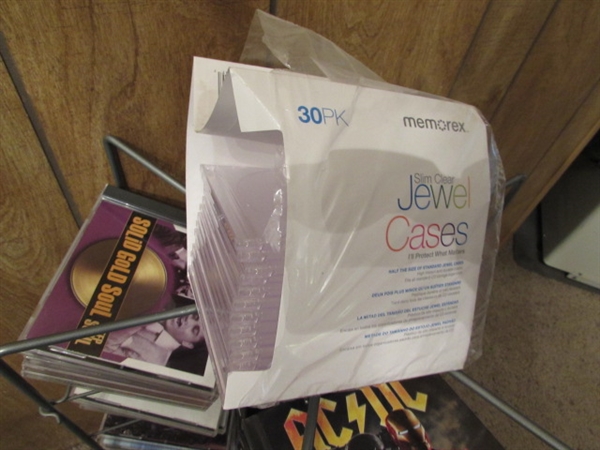 LARGE ASSORTMENT OF CDS ON STAND & EXTRA CASES