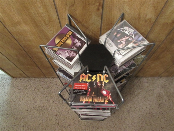 LARGE ASSORTMENT OF CDS ON STAND & EXTRA CASES