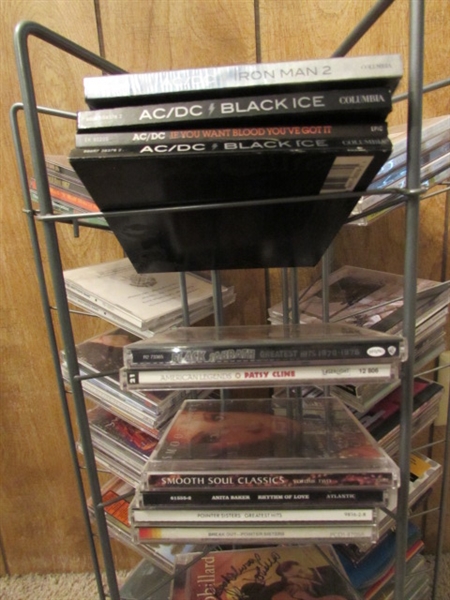 LARGE ASSORTMENT OF CDS ON STAND & EXTRA CASES