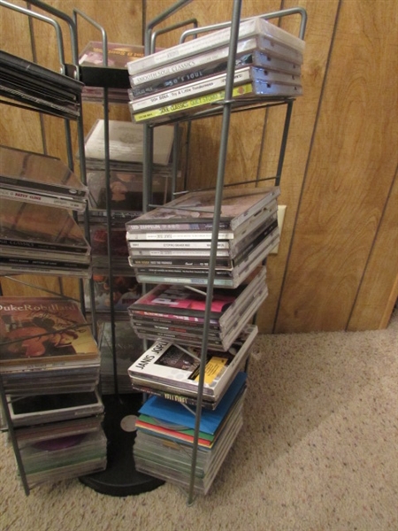 LARGE ASSORTMENT OF CDS ON STAND & EXTRA CASES