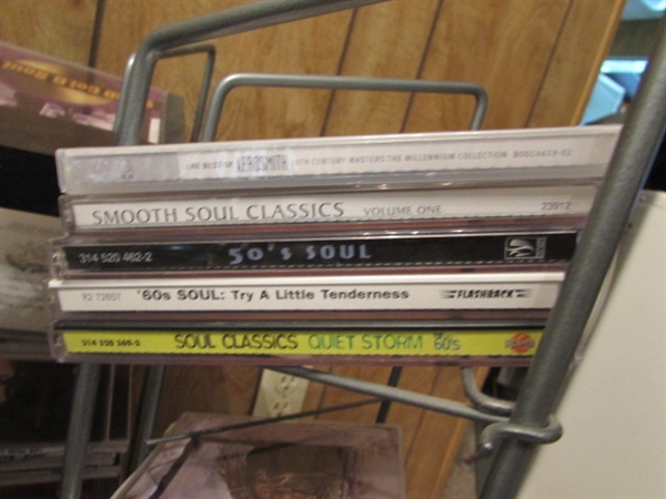 LARGE ASSORTMENT OF CDS ON STAND & EXTRA CASES