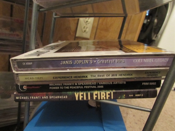 LARGE ASSORTMENT OF CDS ON STAND & EXTRA CASES