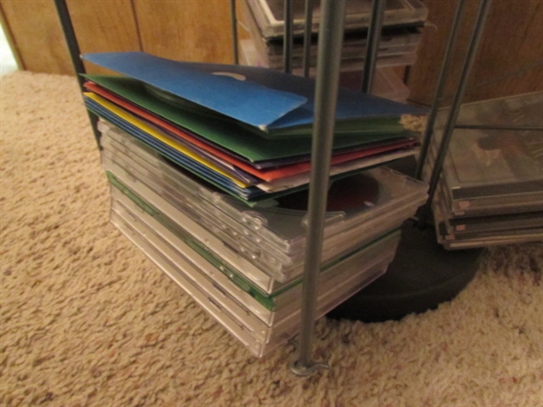 LARGE ASSORTMENT OF CDS ON STAND & EXTRA CASES