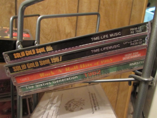 LARGE ASSORTMENT OF CDS ON STAND & EXTRA CASES