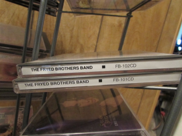 LARGE ASSORTMENT OF CDS ON STAND & EXTRA CASES