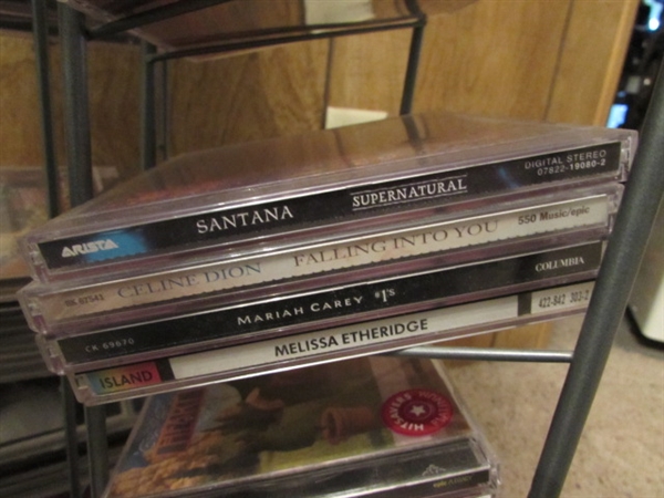 LARGE ASSORTMENT OF CDS ON STAND & EXTRA CASES