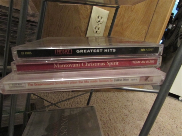 LARGE ASSORTMENT OF CDS ON STAND & EXTRA CASES