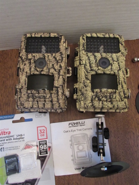 PAIR OF TRAIL CAMERAS, BOTH WORK & COME W/MEMORY CARDS & ADAPTER
