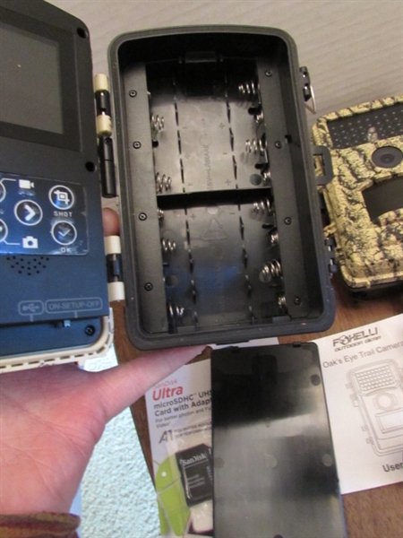 PAIR OF TRAIL CAMERAS, BOTH WORK & COME W/MEMORY CARDS & ADAPTER