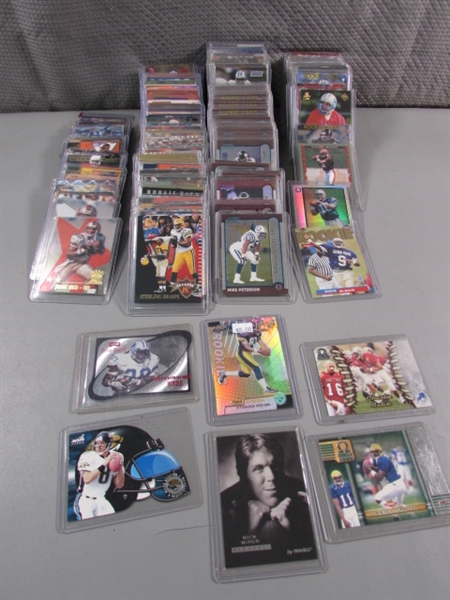 COLLECTION OF FOOTBALL TRADING CARDS IN HARD COVERS