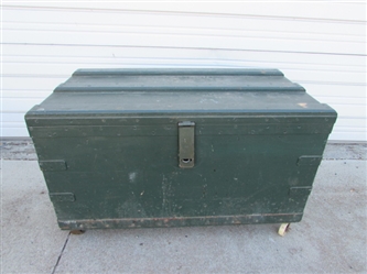 LARGE HEAVY DUTY WOODEN TRUNK ON CASTORS (MISSING 1 WHEEL)