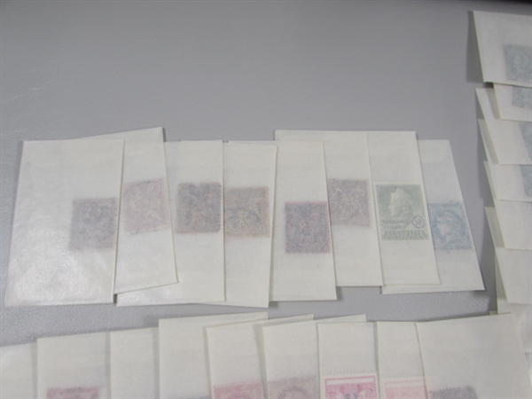 MIXED LOT OF POSTAGE STAMP SINGLES IN GLASSINE ENVELOPES #4