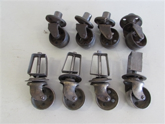 2 SETS OF 4 METAL CASTORS